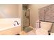 Well-lit bathroom showcasing a tiled shower, soaking tub, and modern toilet at 2875 Prairie Stream Way, Columbus, IN 47203