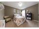 Cozy bedroom features carpet flooring and bright, natural light with ample space at 2875 Prairie Stream Way, Columbus, IN 47203