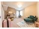Comfortable bedroom featuring carpet flooring, a desk and comfy seating at 2875 Prairie Stream Way, Columbus, IN 47203