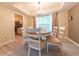 Charming dining room with a chandelier, hardwood floors, and a view into the kitchen at 2875 Prairie Stream Way, Columbus, IN 47203
