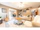 Inviting living room with modern furnishings, a ceiling fan, and an open layout connecting to the kitchen at 2875 Prairie Stream Way, Columbus, IN 47203