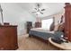Comfortable bedroom with vaulted ceiling, ceiling fan, and a large window at 2875 Prairie Stream Way, Columbus, IN 47203