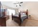Bedroom featuring a vaulted ceiling, ceiling fan, and a large dresser at 2875 Prairie Stream Way, Columbus, IN 47203