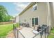 A cozy patio area with an iron fence features a sliding glass door and outdoor seating at 2875 Prairie Stream Way, Columbus, IN 47203