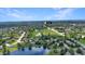 Wide aerial shot of home with a large pond on a bright, sunny day at 319 Mcintosh Ln, Westfield, IN 46074