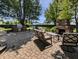 Outdoor patio area featuring brick pavers, built-in outdoor kitchen with a fireplace and seating at 319 Mcintosh Ln, Westfield, IN 46074