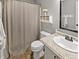 Clean bathroom with a shower curtain, white vanity, and decorative accents at 319 Mcintosh Ln, Westfield, IN 46074
