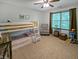 This bedroom has a bunk bed and a cozy armchair by the window, perfect for a room at 319 Mcintosh Ln, Westfield, IN 46074