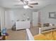 Bright bedroom featuring a ceiling fan, white dresser, and neutral carpet at 319 Mcintosh Ln, Westfield, IN 46074