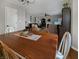 Dining area with wood table and chairs, open to the living space with lots of light at 319 Mcintosh Ln, Westfield, IN 46074