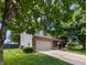 Charming two-story home featuring a well-manicured lawn, front porch and attached two car garage at 319 Mcintosh Ln, Westfield, IN 46074