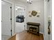 Hallway leads to a bedroom with a dark crib and décor on the walls at 319 Mcintosh Ln, Westfield, IN 46074