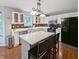 Bright kitchen with white cabinetry, quartz countertops, island with seating and stainless steel appliances at 319 Mcintosh Ln, Westfield, IN 46074