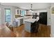 View of the kitchen featuring white cabinets, a center island with seating and stainless steel appliances at 319 Mcintosh Ln, Westfield, IN 46074