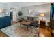 Comfortable living room featuring couch, accent table, area rug, and hardwood floors at 319 Mcintosh Ln, Westfield, IN 46074