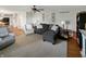 Spacious living room featuring hardwood floors, neutral tones, and an inviting seating arrangement at 319 Mcintosh Ln, Westfield, IN 46074