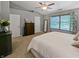 Gray main bedroom with carpet floors, vaulted ceiling, ceiling fan and large window at 319 Mcintosh Ln, Westfield, IN 46074