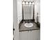 Close-up of a powder room featuring a pedestal sink and decorative mirror at 319 Mcintosh Ln, Westfield, IN 46074