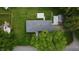 Aerial shot shows a well-manicured lawn with fencing, complemented by mature trees and a detached shed at 3457 W 58Th St, Indianapolis, IN 46228