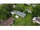 Aerial shot reveals a spacious yard, detached shed, and neighboring houses in a suburban setting at 3457 W 58Th St, Indianapolis, IN 46228