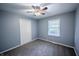 Neutral bedroom with plush carpet, ceiling fan, closet, and ample natural light at 3457 W 58Th St, Indianapolis, IN 46228