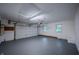 Spacious garage with freshly painted floors and walls, and ample storage space at 3457 W 58Th St, Indianapolis, IN 46228