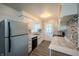 Stylish kitchen with white cabinets, stainless steel appliances, and mosaic backsplash at 3457 W 58Th St, Indianapolis, IN 46228