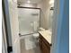 Bathroom featuring shower, vanity with sink, toilet, and updated fixtures at 425 Bridgewater S Ln, Muncie, IN 47304