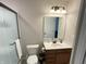 Bathroom featuring shower, vanity with sink, toilet, and updated fixtures at 425 Bridgewater S Ln, Muncie, IN 47304