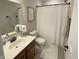 Bathroom featuring shower, vanity with sink, toilet, and updated fixtures at 425 Bridgewater S Ln, Muncie, IN 47304