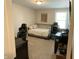 Carpeted bedroom with a bed and desk at 425 Bridgewater S Ln, Muncie, IN 47304