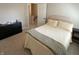 Bedroom featuring a cozy bed, dresser, and carpeting at 425 Bridgewater S Ln, Muncie, IN 47304