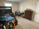 Bedroom featuring carpeted floors, a bunk bed, a desk, and a dresser at 425 Bridgewater S Ln, Muncie, IN 47304
