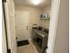 Laundry room with modern washer and dryer, with shelving for storage at 425 Bridgewater S Ln, Muncie, IN 47304