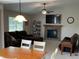 Open living room featuring a brick fireplace, TV, and a large comfortable-looking sofa at 425 Bridgewater S Ln, Muncie, IN 47304