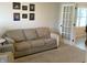 Cozy living room features neutral decor, sofa, and adjacent sitting area at 425 Bridgewater S Ln, Muncie, IN 47304