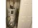 Water heater inside of closet with white doors at 425 Bridgewater S Ln, Muncie, IN 47304