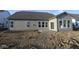 New construction home with walk-out patio and large windows; yard ready for your personal touch at 4250 Ironclad Dr, Bargersville, IN 46106