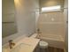 Bright bathroom featuring a tub/shower combo and a white vanity with modern fixtures at 4250 Ironclad Dr, Bargersville, IN 46106
