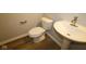 Modern half bath with pedestal sink and hardwood floors at 4250 Ironclad Dr, Bargersville, IN 46106