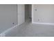 Bright bedroom with neutral walls, white trim, and a doorway leading to another room at 4250 Ironclad Dr, Bargersville, IN 46106