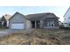 Charming single-Gathering home with stone accents, attached two car garage, and covered front entry at 4250 Ironclad Dr, Bargersville, IN 46106