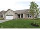 Charming single-story home with a well-manicured lawn and attached two-car garage at 4250 Ironclad Dr, Bargersville, IN 46106