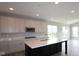 Modern kitchen featuring a large island, stainless steel appliances, and ample cabinet space at 4250 Ironclad Dr, Bargersville, IN 46106