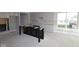 Bright kitchen features unfinished island, white cabinets and stainless appliances, offering modern elegance at 4250 Ironclad Dr, Bargersville, IN 46106