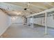 Unfinished basement with white walls, concrete flooring, and exposed white ceiling beams at 4337 English Ave, Indianapolis, IN 46201
