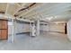 A spacious unfinished basement with exposed beams at 4337 English Ave, Indianapolis, IN 46201