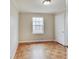 A light-filled bedroom with neutral walls and parquet floors at 4337 English Ave, Indianapolis, IN 46201