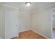 Small bedroom space with parquet floor and simple neutral decor at 4337 English Ave, Indianapolis, IN 46201