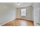 A cozy bedroom offers natural light and a closet for storage at 4337 English Ave, Indianapolis, IN 46201